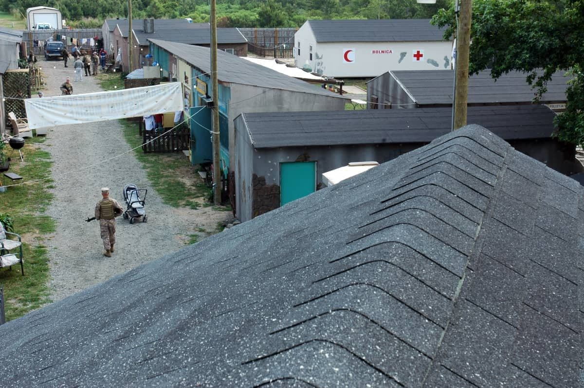 Sailors and Marines of the Navy-Marine Corps Intelligence Command (NMITC) running an urban training exercise at Dam Neck Annex.