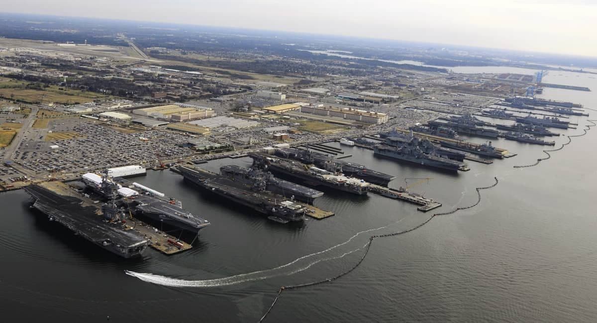 Nine U.S. Navy aircraft carriers and other warships moored at piers at Naval Station Norfolk in December 2012.