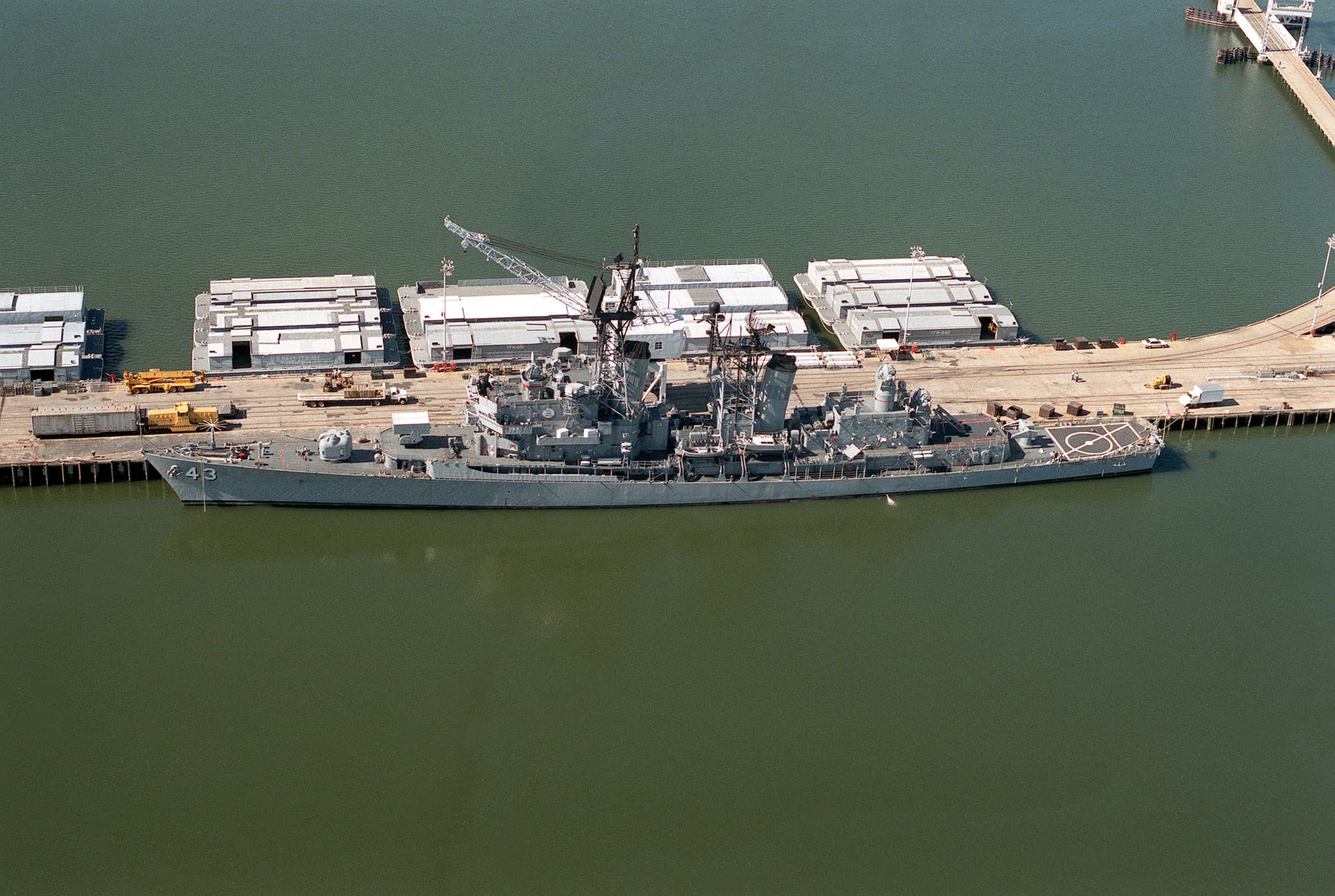 USS Dahlgren (DDG-43) at the pier at Naval Weapons Station Yorktown, 1990.